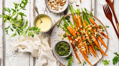 Glazed carrots with carrot top pesto and tahini dressing