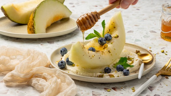 Piel-de-sapo melon on cinnamon vanilla ricotta, with blueberries, pistachios, mint and honey